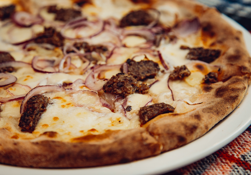 La Favorita's pizza with haggis, red onions, sliced potatoes, super creamy mozzarella and a drizzle of whisky to complete the meal
