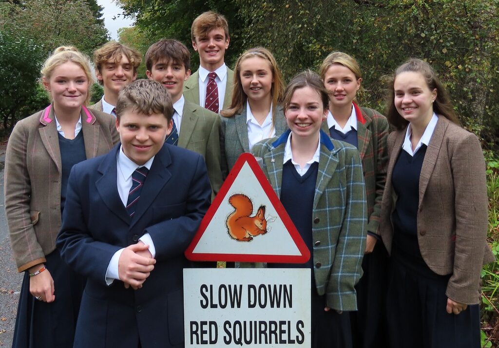 Some of the Glenalmond College pupils who took part in the survey are pictured with one of the school’s road signs warning drivers to be aware of the school’s red squirrel population